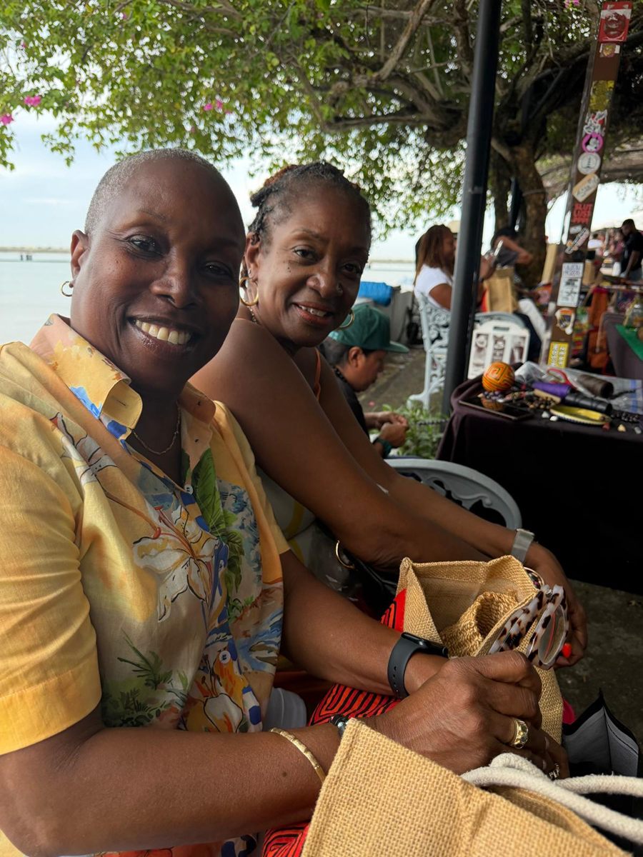 Members at the artisan market stalls by the waterfront