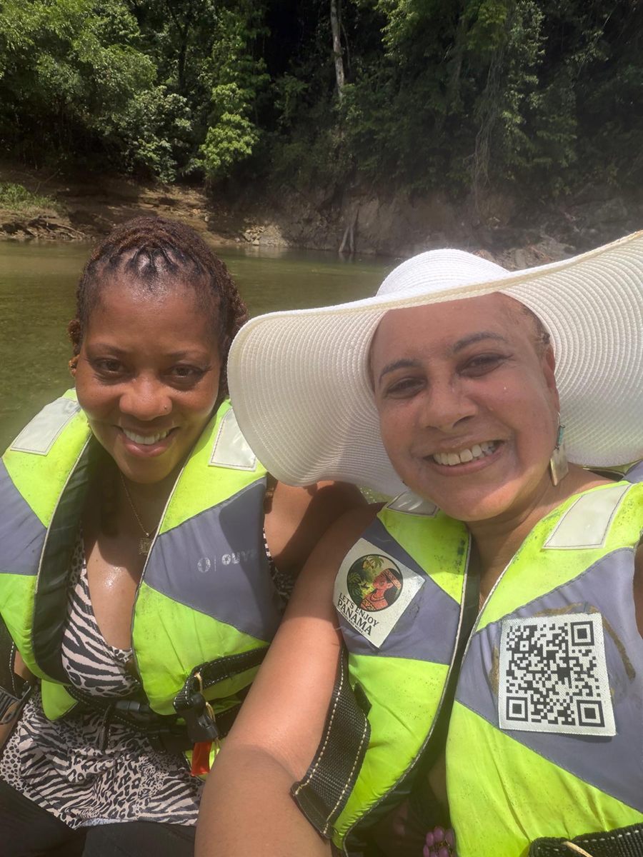 Two members smiling on the river boat