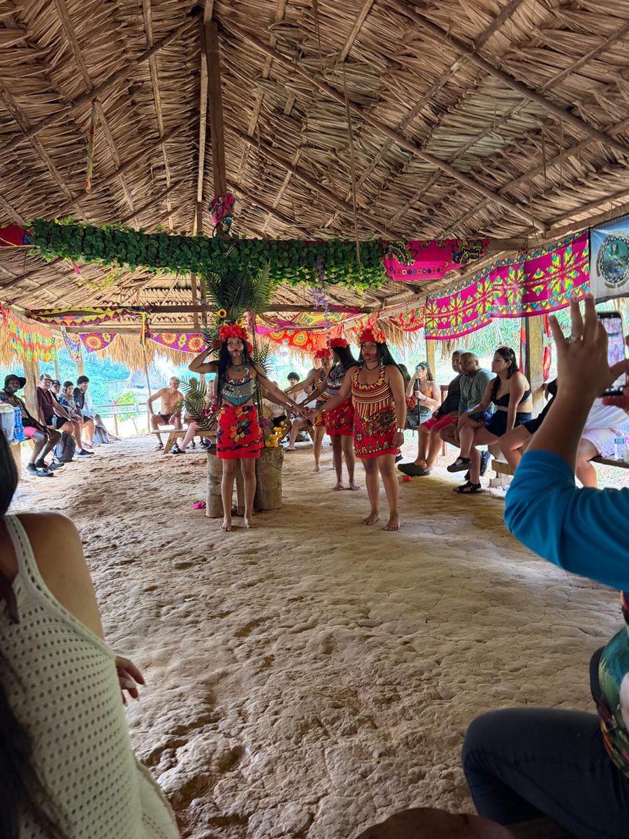 Traditional Emberá dance performance inside the thatched community hut