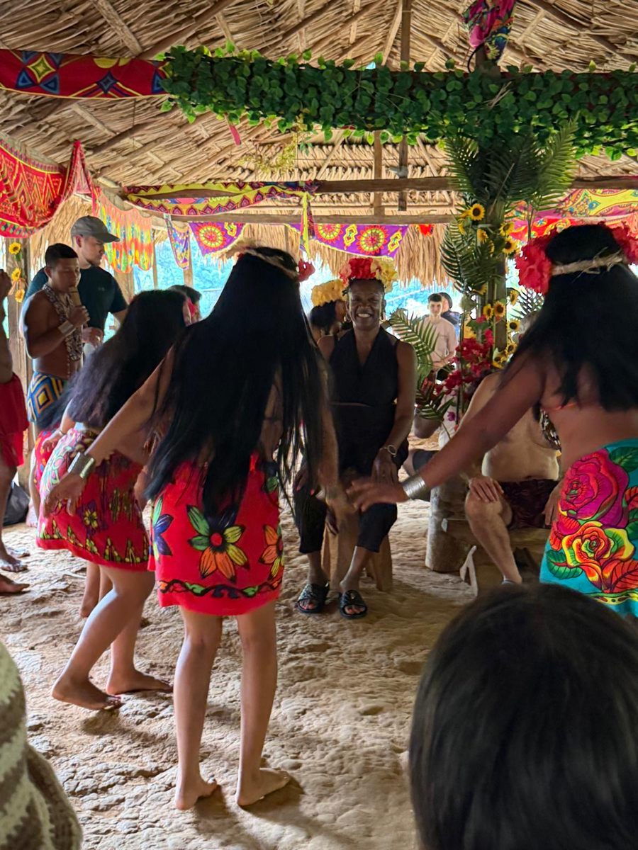 Visitors joining the Emberá dancers in the community hut