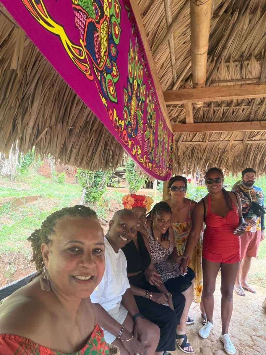 Group photo with members under the mola canopy