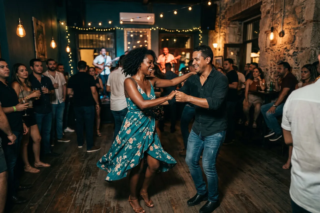A couple dancing salsa in a lively club under string lights